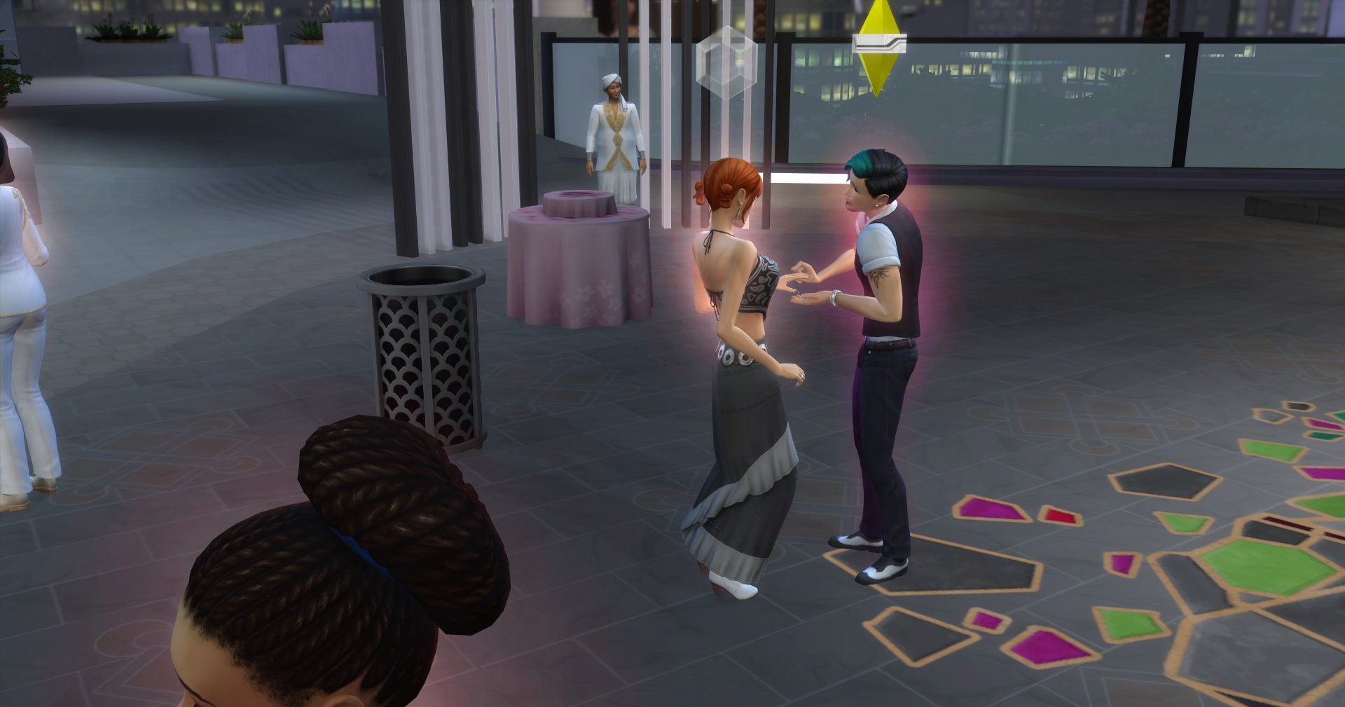 Gus placing ring on Angelas finger